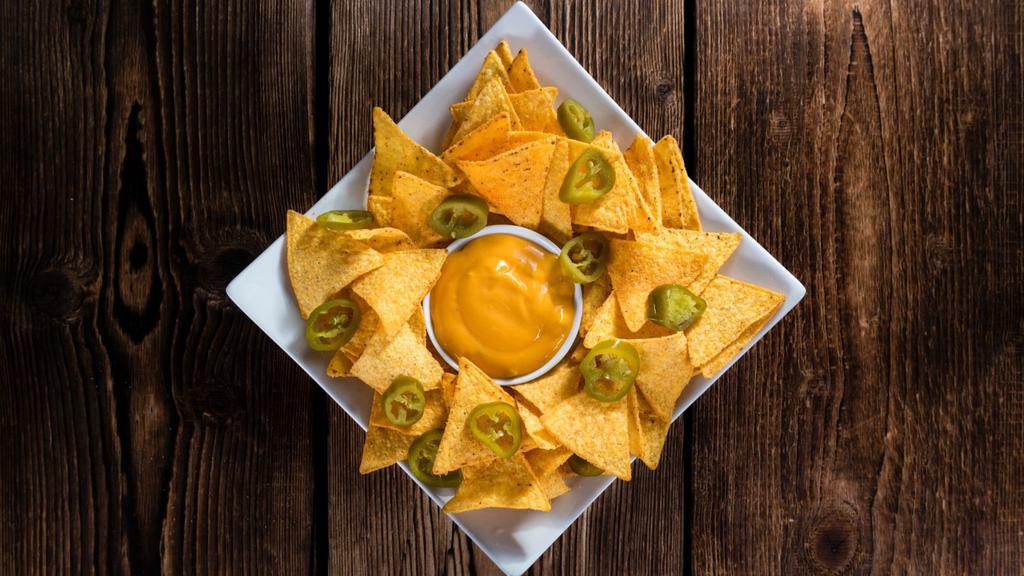 Cheese Nachos · Creamy cheese drizzled over fresh tortilla chips.