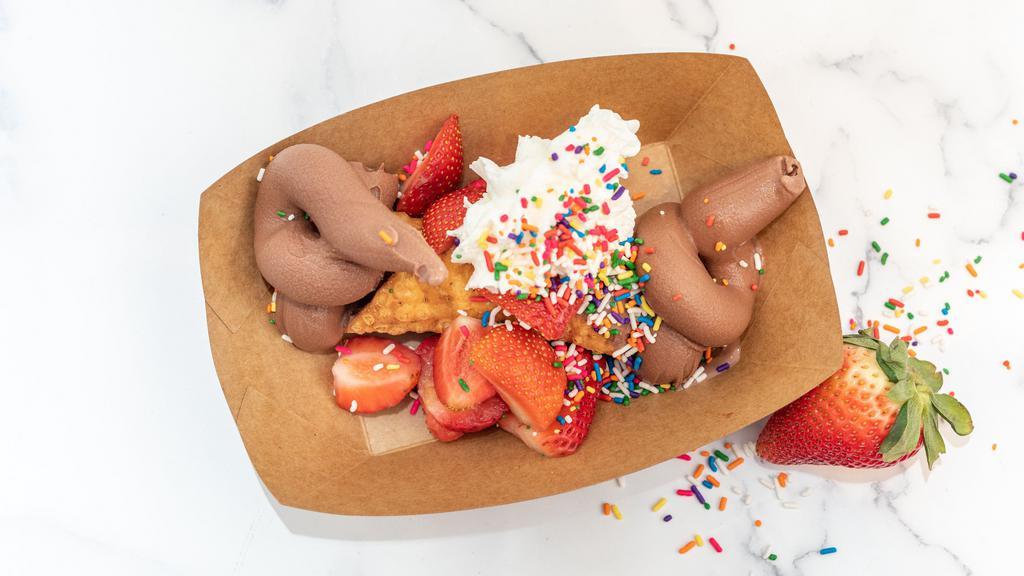 The Fat Cannoli · Deep-fried cannoli shell filled with handcrafted chocolate gelato with fresh strawberries, whip cream, and sprinkles. This classic is to die for!