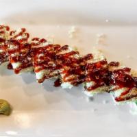 Shrimp Crunchy Roll (Half) · Inside: crab, shrimp tempura, cucumber, avocado. On top: tempura crumbs, eel sauce.