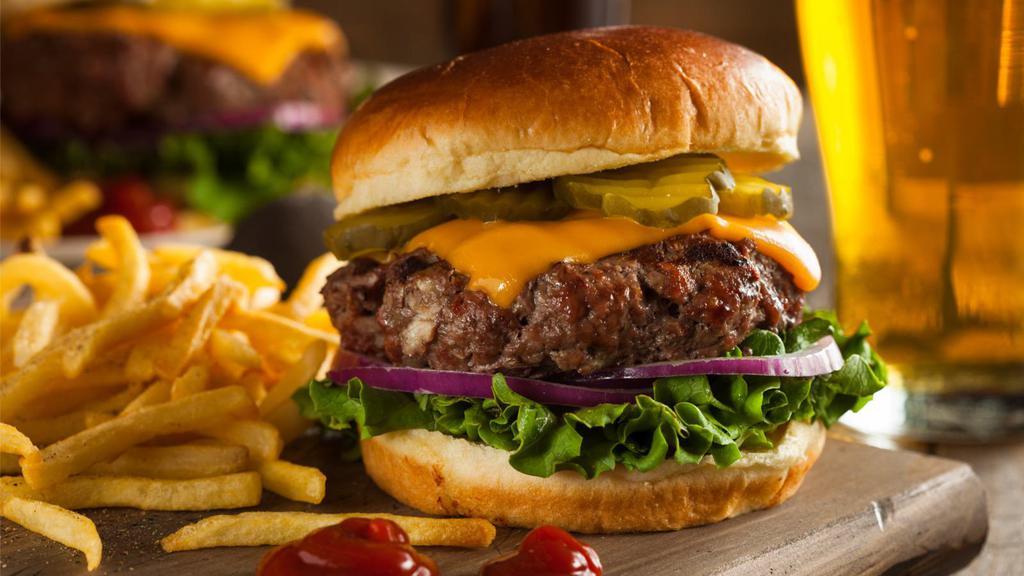 Hamburger · Fresh quarter pound beef patty with lettuce, tomatoes, onions and pickles. Served with customer's choice of Onions rings, french fries or salad.