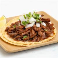 Guajillo Braised Beef Taco · chipotle, cumin, mexican oregano.  All tacos served with three signature salsas.
