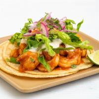 Spicy Shrimp Taco · morita-arbol salsa, crema, lettuce, habanero-onion pickles.  All tacos served with three sig...