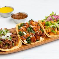 Three Tacos · Choice of three tacos.  All tacos served with three signature salsas.