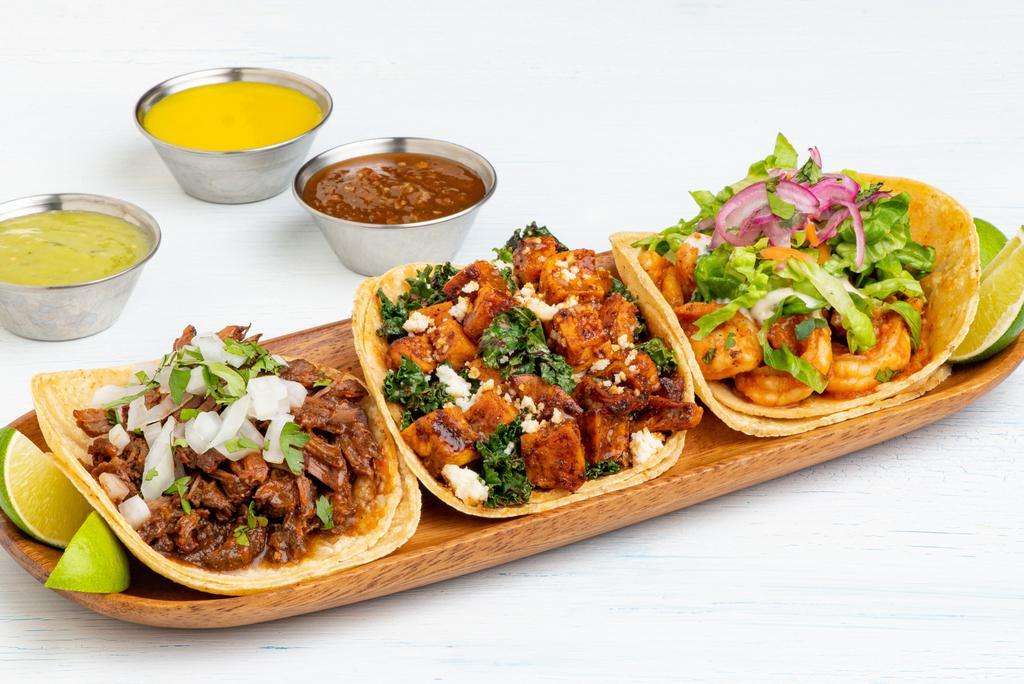 Three Tacos · Choice of three tacos.  All tacos served with three signature salsas.