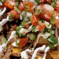 Birria Totchos  · Crispy tater tots topped with nacho cheese, pico de gallo, sour cream, and braised beef birr...