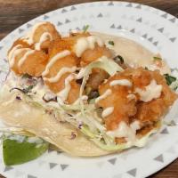 Baja Shrimp · Fried shrimp tacos topped with cabbage, baja crema, spicy street sauce and pico de gallo.
