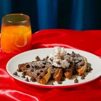 Nutella Chocolate Chip French Toast · Four slices of thick, egg-washed cinnamon bread topped with Nutella and chocolate chips, and...