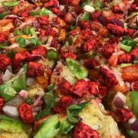 Vegan Tandoori Chicken · Bell peppers, red onions, tomatoes, vegan chicken, vegan tandoori sauce, vegan cheese.