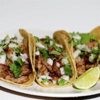 The Carnitas Taco · Our famous specially seasoned pork, slow cooked to perfection, with chopped onions, freshly ...