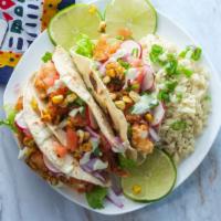 Spicy Tofusion Taco · Healthy tofu taco with grilled fajita mix (onions, green and red peppers), tofu, shredded ca...