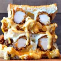Nashville Hot Chicken Grilled Cheese · Crispy Nashville hot chicken tenders, and mac and cheese topped with cheddar and provolone c...