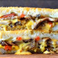 Philly Grilled Cheese  · Sliced sirloin, mushrooms, red peppers, caramelized onions, provolone and American cheese on...