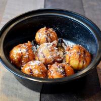 Deep Fried Cookie Dough  · Deep-fried battered cookie dough with a warm, gooey center, topped with chocolate and carame...
