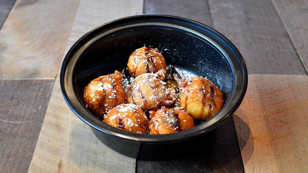 Deep Fried Cookie Dough  · Deep-fried battered cookie dough with a warm, gooey center, topped with chocolate and caramel sauce.
