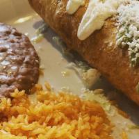 Chimichanga · Meat with cheese, salsa Mexicana inside. Deep-fried to a golden brown and topped with sour c...