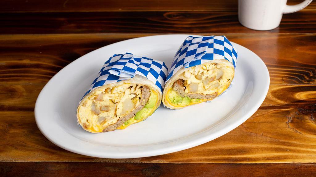 Breakfast wrap With meat and avocado · Choice of meat: bacon, ham, turkey, or sausage. (Choose one meat)
Egg, potato, American cheese, and avocado wrapped in a soft flour tortilla