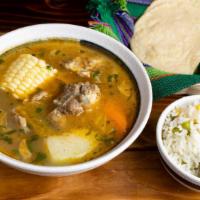 Caldo de Res · Beef soup with some vegetables ( corn on the cob, yuca, cilantro carrots, chayote, potato) s...