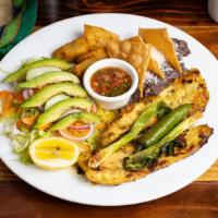 Pollo a la Plancha · A Sliced of grilled chicken, casamiento ( refried black beans mixed with rice) salad, fried ...