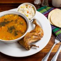 Pepian de Gallina · Guatemalan hen stew with some vegetables ( carrots, chayote, potato) served with rice and ha...