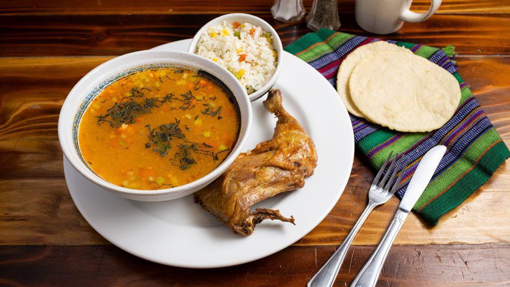 Pepian de Gallina · Guatemalan hen stew with some vegetables ( carrots, chayote, potato) served with rice and hand made tortillas on the side