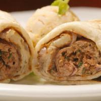 Spicy Seekh Kabob Wrap · Ground lamb kabob seasoned with green chili, ginger, and spices alongside onions, cilantro, ...