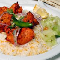 Chicken Tikka Kabob Plate · Boneless tandoori chicken white meat 4 pieces. Served over basmati rice, with garlic naan, d...