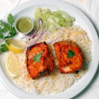 Tandoori Salmon Plate · Boneless marinated tandoori salmon fillet served over basmati rice, with garlic naan, dal, a...