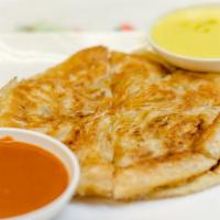 Thai Pancake (Roti) · Pan-fried pastry served with yellow curry and peanut sauce.