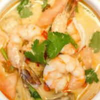 Tom Kha Soup (Large) · Authentic Thai hot and sour soup in coconut milk, mushrooms, baby corn, kaffir leaves, galan...