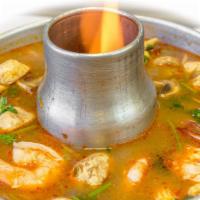 Tom Yum Soup (Large) · Authentic Thai hot and sour soup with mushroom, baby corn, lemongrass, kaffir leaves, galang...