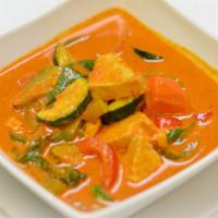 Panang Curry · Panang curry paste with creamy coconut milk, zucchini, sweet basil, peas and carrots, and be...