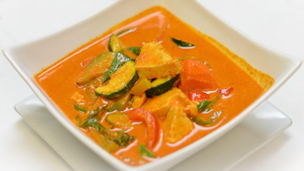 Panang Curry · Panang curry paste with creamy coconut milk, zucchini, sweet basil, peas and carrots, and bell peppers.