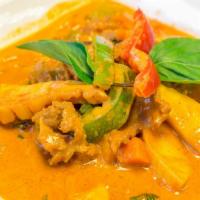 Red Curry · Red curry in coconut milk with bamboo shoots, peas, and carrots, bell peppers, and basil lea...