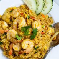 The Royal Pineapple Fried Rice · Special fried rice with pineapple chunks, cashew nuts, eggs, peas, and carrots, onions.