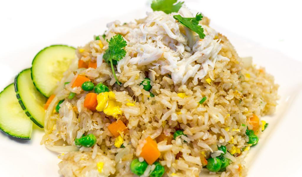 Fried Rice with Crab Meat · Pan-fried rice with egg, crab meat, peas, and carrots, onions.
(Come together with Thai ice tea or Thai ice coffee) Please click the icon of Thai ice tea when you check out this item.