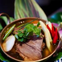Tom-Zaab Beef · Laotian spicy sour soup + 24-hour braised beef short ribs + hard herbs + Thai basil