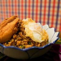 Lao Fried Rice · Laotian style fried rice + minced chicken + Thai basil + organic chicken wings W/ fried egg