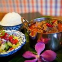 Panang Lamb Curry · Thick coconut milk curry + lamb stew W/ cucumber salad