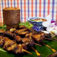 Moo Ping · Street style grilled marinated pork skewers + tamarind-chili dip w/ sticky rice