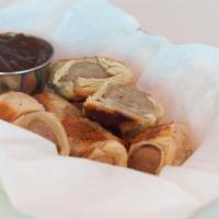 SAUSAGE ROLLS (8 PIECE) · DELICATE AND FLAKY PUFF PASTRY SURROUNDING BRITISH BANGER SAUSAGE