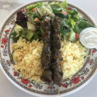 Lamb Kabobs Plate · Two lamb skewers served with rice pilaf, salad, and tzatziki.