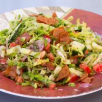 26. Fattoush Salad · Vegetarian. Lettuce, tomatoes, cucumbers, onions, and pita chips.