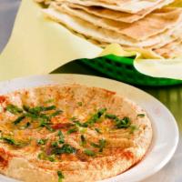 Hummus · Vegetarian. Garbanzo beans dip served with pita.