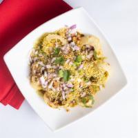 Dahi Batata Puri · Crispy shells filled with potatoes, onions, yogurt with spices and chutneys with sev.