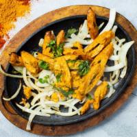 Tikka on the Run · Boneless tandoori chicken pieces served with basmati rice, garlic naan, dal or curry sauce a...