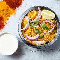 Eggilicious Biryani · Boiled eggs cooked in basmati rice. Served with raita or curry sauce.