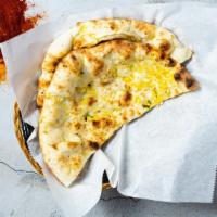 Garlic Naan · Freshly baked bread in a clay oven garnished with garlic and butter - talk about getting' fr...