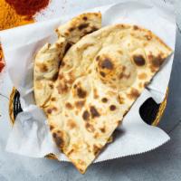 Tandoori Roti · Whole wheat Indian bread cooked in a clay oven - a bread you'll be lovin'.