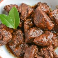 Adobo (Pork) · Pork and Quail Eggs braised in vinegar, soy sauce, garlic, bay leaves, black peppercorns and...