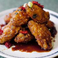 A6. Dry Fried Chicken Wings(8) · 8 pieces. Deep-fried chicken wings with garlic, ginger, spicy red pepper.